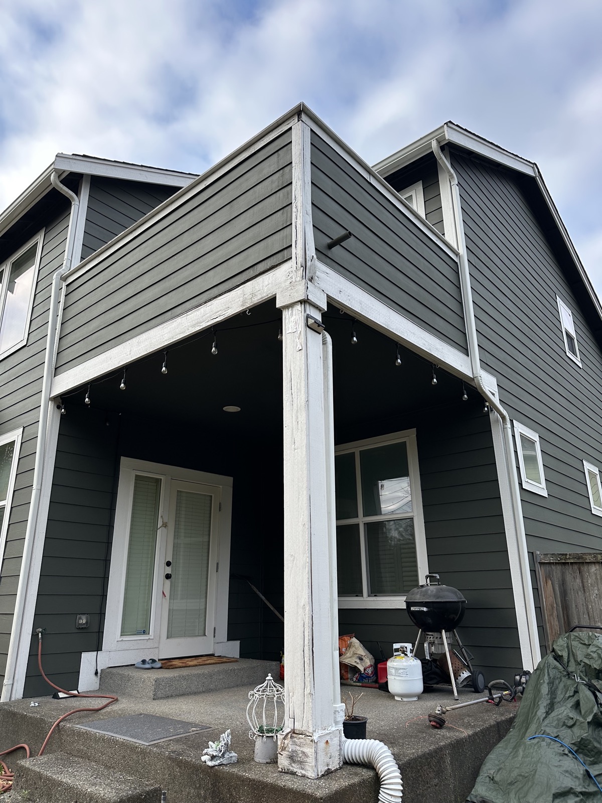 Hunter-green lap siding with white trim and covered patio, South Hill, Puyallup