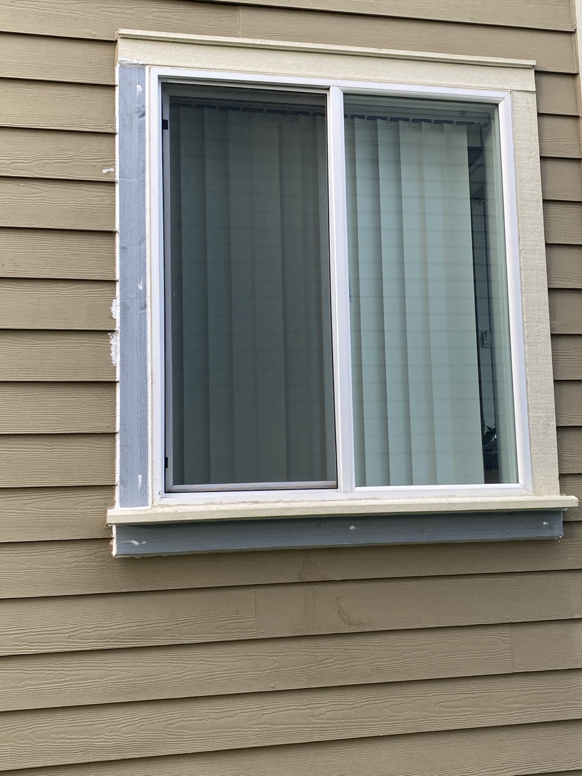 New replacement windows and board-and-batten siding installed by PrimeGuard Exteriors on a Puget Sound area home