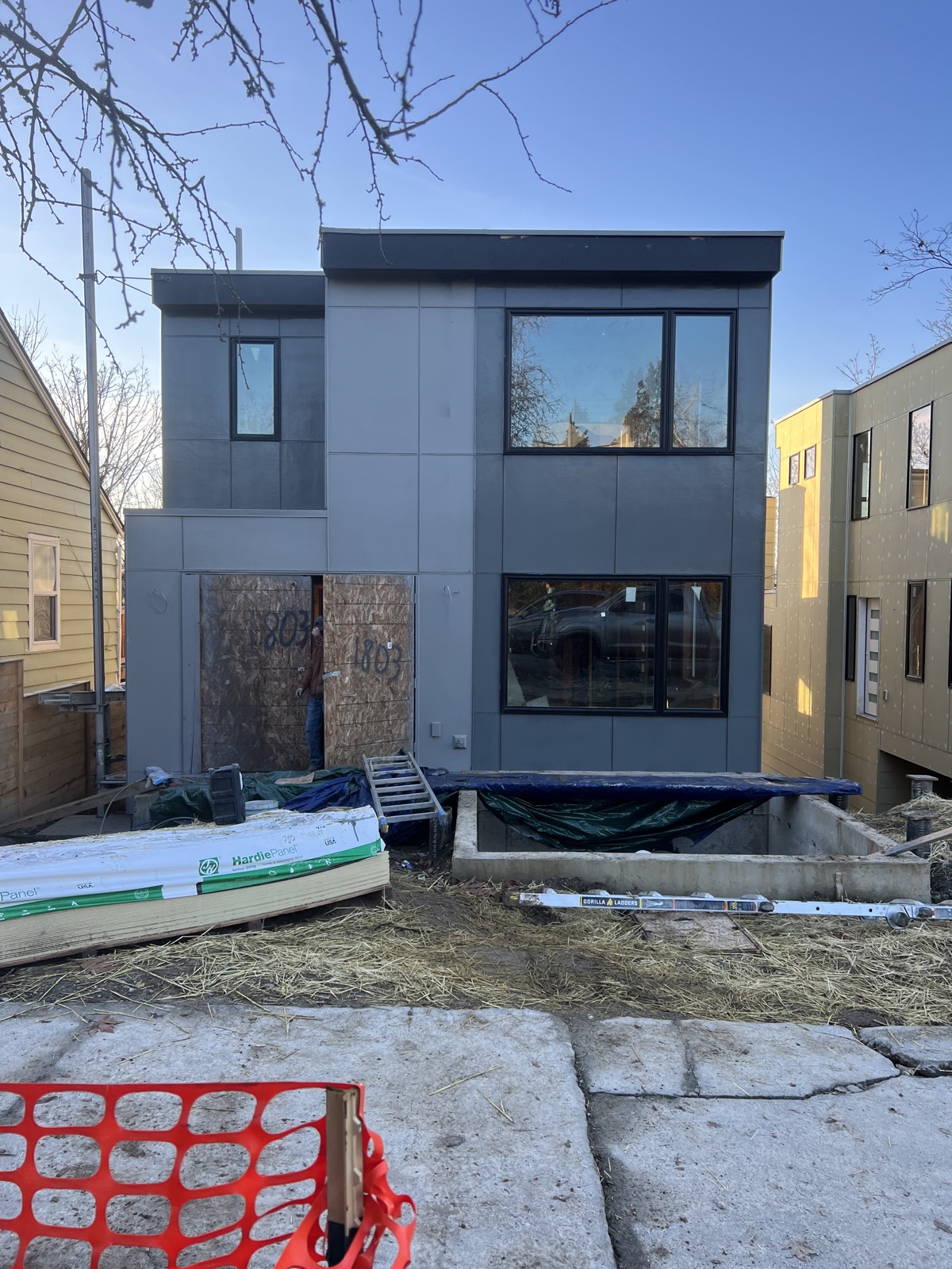 Two-tone James Hardie panel siding mid-installation near Cherry Street, Seattle